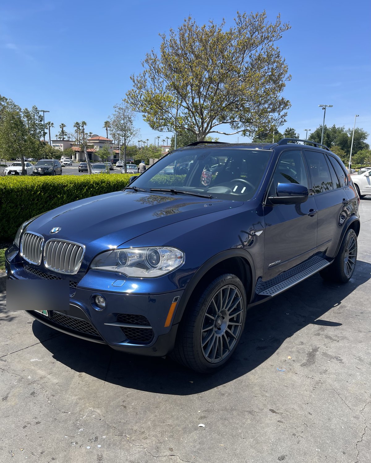 Dark blue BMW X5 at Mission Grove Car Wash in Riverside